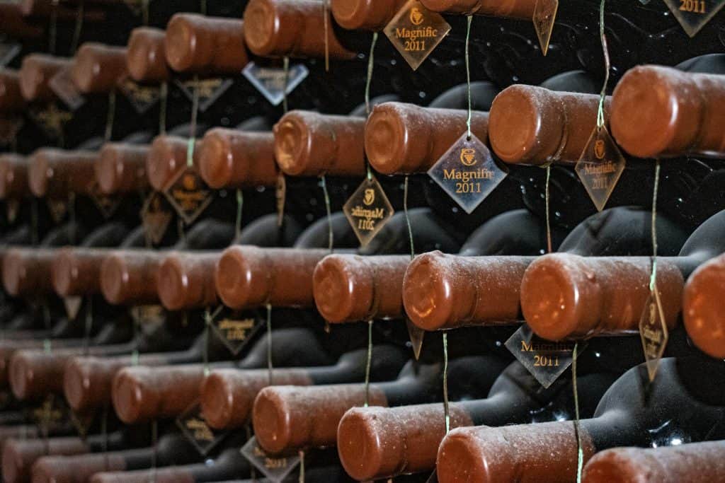 Labeled Bottles in a Wine Cellar